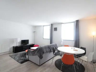 a living room with a couch and a table at Appartement 2 pièces pour 5 pers. à Flaine Forêt, à 350m des pistes et proche des commerces - FR-1-687-34 in Arâches-la-Frasse