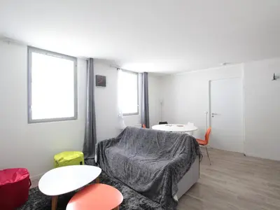 a living room with a couch and a table at Appartement 2 pièces pour 5 pers. à Flaine Forêt, à 350m des pistes et proche des commerces - FR-1-687-34 in Arâches-la-Frasse