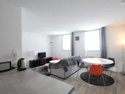 a living room with a couch and a table at Appartement 2 pièces pour 5 pers. à Flaine Forêt, à 350m des pistes et proche des commerces - FR-1-687-34 in Arâches-la-Frasse