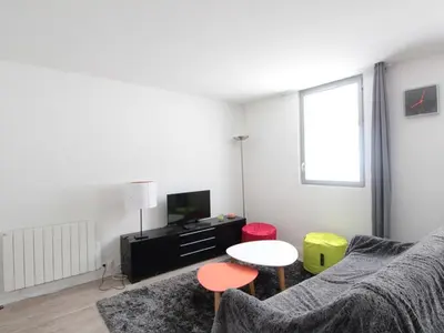 a living room with a couch and a table at Appartement 2 pièces pour 5 pers. à Flaine Forêt, à 350m des pistes et proche des commerces - FR-1-687-34 in Arâches-la-Frasse