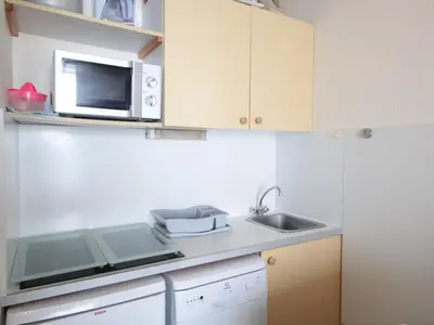 a small kitchen with a microwave and a sink at Studio Cabine 5 pers avec Balcon - Résidence Sagittaire, Flaine Forêt - FR-1-687-43 in Arâches-la-Frasse
