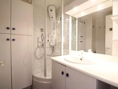 a white bathroom with a sink and a shower at Studio 4 pers, proche pistes, animaux bienvenus - FR-1-687-37 in Arâches-la-Frasse
