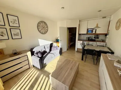 a living room with a couch and a table at Studio 4 pers, proche pistes, animaux bienvenus - FR-1-687-37 in Arâches-la-Frasse