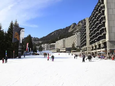a group of people standing in the snow in a city at Appartement rénové 2 pièces pour 6 personnes avec balcon sud à 300m des pistes - Flaine Forêt - FR-1-687-48 in Arâches-la-Frasse