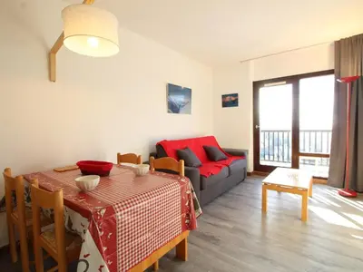a living room with a table and a couch at Studio rénové 4 pers avec balcon sud, proche pistes et commerces, casier à skis, parking - FR-1-687-33 in Arâches-la-Frasse