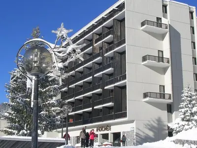 a building with a street light in front of it at Studio rénové 4 pers avec balcon sud, proche pistes et commerces, casier à skis, parking - FR-1-687-33 in Arâches-la-Frasse
