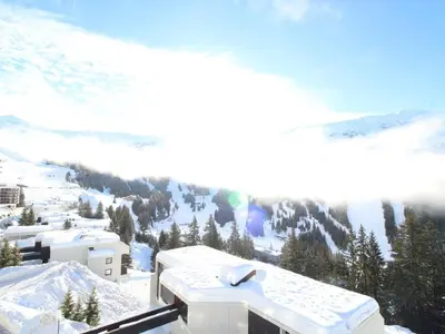 a view of a snow covered mountain with a building at Studio rénové 4 pers avec balcon sud, proche pistes et commerces, casier à skis, parking - FR-1-687-33 in Arâches-la-Frasse
