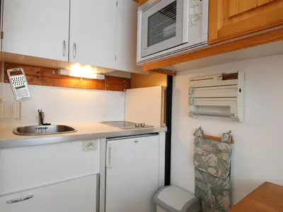 a bunk bed room with two bunk beds and a door at Studio en front de neige à Flaine, idéal pour skieurs, 4 pers, animaux admis - FR-1-687-58 in Arâches-la-Frasse