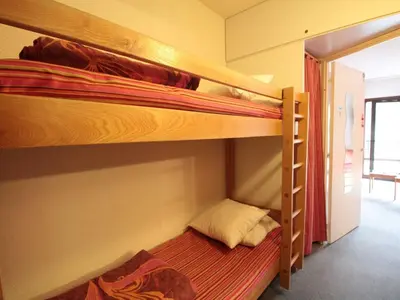 two bunk beds in a small room with a bed at Studio Coin Montagne 25m² à Flaine, balcon et proximité pistes - FR-1-687-42 in Arâches-la-Frasse