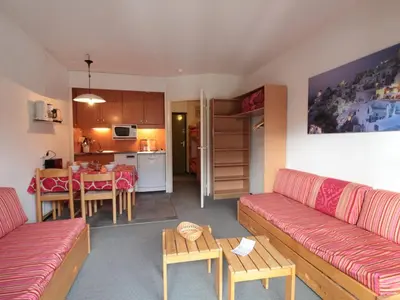 a living room with a couch and a table at Studio Coin Montagne 25m² à Flaine, balcon et proximité pistes - FR-1-687-42 in Arâches-la-Frasse