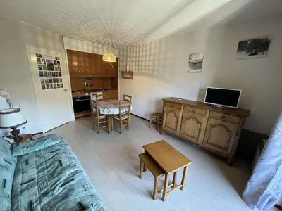 a living room with a couch and a table at Studio pour 4 pers., proche pistes et commerces, balcon sud, à Flaine Forêt - FR-1-687-66 in Arâches-la-Frasse