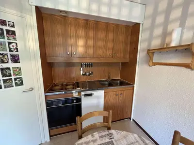 a small kitchen with a sink and a stove at Studio pour 4 pers., proche pistes et commerces, balcon sud, à Flaine Forêt - FR-1-687-66 in Arâches-la-Frasse