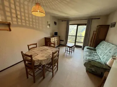 a living room with a table and a couch at Studio pour 4 pers., proche pistes et commerces, balcon sud, à Flaine Forêt - FR-1-687-66 in Arâches-la-Frasse