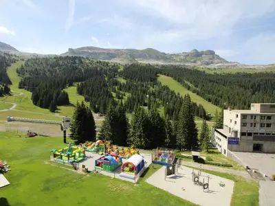 an aerial view of a park with a playground at Appartement 2 Pièces pour 6 Personnes au Pied des Pistes – Flaine Forum, Résidence Aldebarran - FR-1-687-99 in Arâches-la-Frasse