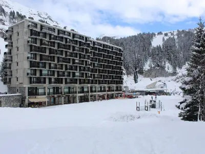 a large building in the snow with a snow covered field at Appartement 2 Pièces pour 6 Personnes au Pied des Pistes – Flaine Forum, Résidence Aldebarran - FR-1-687-99 in Arâches-la-Frasse