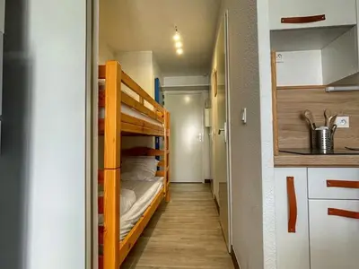 a small room with two bunk beds in it at Charmant Studio Cabine avec Coin Montagne pour 5 Pers., Résidence Doris, Proche Pistes et Commerces. - FR-1-687-62 in Arâches-la-Frasse