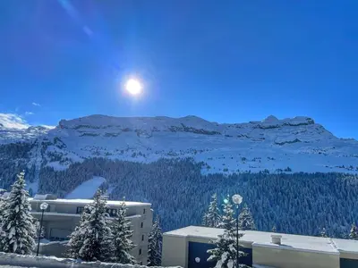a view of a mountain with the moon in the sky at Charmant Studio Cabine avec Coin Montagne pour 5 Pers., Résidence Doris, Proche Pistes et Commerces. - FR-1-687-62 in Arâches-la-Frasse