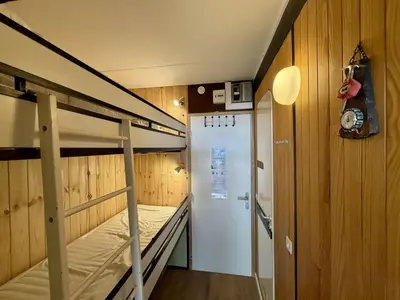 a bunk bed room with a bunk bed in a room at Studio 4 pers. sur les pistes à Flaine, parking, casier à skis, terrasse - FR-1-687-75 in Arâches-la-Frasse