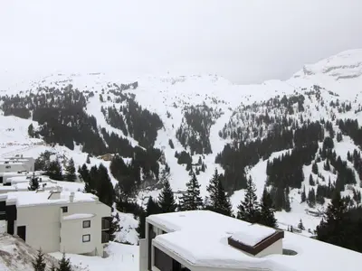 a view of a snow covered mountain from a building at Studio cosy pour 4 personnes - résidence Andromède, Flaine Forêt, proche pistes et commerces - FR-1-687-107 in Arâches-la-Frasse
