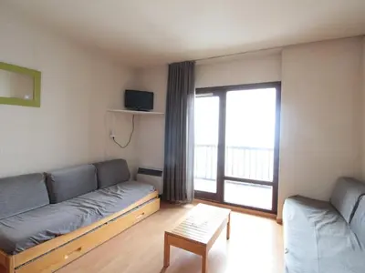 a living room with a couch and a large window at Studio cosy pour 4 personnes - résidence Andromède, Flaine Forêt, proche pistes et commerces - FR-1-687-107 in Arâches-la-Frasse