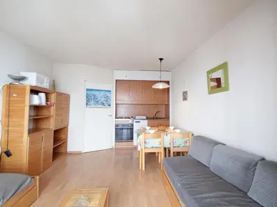 a living room with a couch and a table at Studio cosy pour 4 personnes - résidence Andromède, Flaine Forêt, proche pistes et commerces - FR-1-687-107 in Arâches-la-Frasse