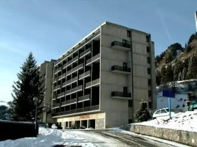 a building on a snowy street in front of a building at Studio cosy pour 4 personnes - résidence Andromède, Flaine Forêt, proche pistes et commerces - FR-1-687-107 in Arâches-la-Frasse