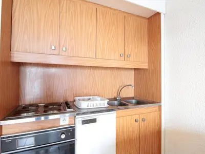 a kitchen with a sink and a stove and cabinets at Studio cosy pour 4 personnes - résidence Andromède, Flaine Forêt, proche pistes et commerces - FR-1-687-107 in Arâches-la-Frasse