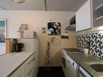 a small kitchen with white cabinets and a sink at Appartement 3 pièces pour 8 pers. au pied des pistes – Résidence Aldebarran, Flaine Forum - FR-1-687-98 in Arâches-la-Frasse