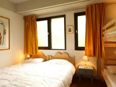 a bedroom with a white bed and two windows at Appartement 3 pièces pour 8 pers. au pied des pistes – Résidence Aldebarran, Flaine Forum - FR-1-687-98 in Arâches-la-Frasse