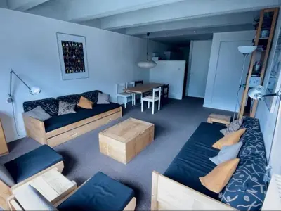 a living room with a couch and a table at 2 pièces à Flaine, 6 couchages, à 50m des pistes - FR-1-687-89 in Arâches-la-Frasse