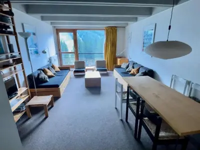 a living room with a couch and a table at 2 pièces à Flaine, 6 couchages, à 50m des pistes - FR-1-687-89 in Arâches-la-Frasse