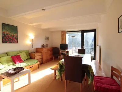 a living room with a couch and a table at Flaine, 3 pièces, 8 pers, près des pistes, vue domaine skiable - FR-1-687-83 in Arâches-la-Frasse