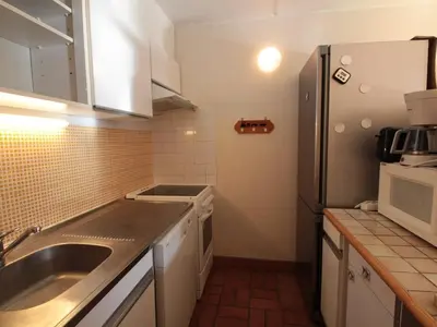 a small kitchen with a sink and a refrigerator at Flaine, 3 pièces, 8 pers, près des pistes, vue domaine skiable - FR-1-687-83 in Arâches-la-Frasse