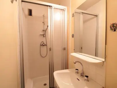 a white bathroom with a shower and a sink at Flaine, 3 pièces, 8 pers, près des pistes, vue domaine skiable - FR-1-687-83 in Arâches-la-Frasse
