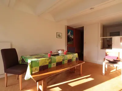 a living room with a table and a chair at Flaine, 3 pièces, 8 pers, près des pistes, vue domaine skiable - FR-1-687-83 in Arâches-la-Frasse
