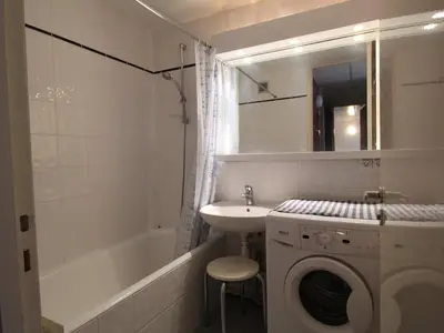 a bathroom with a washing machine and a sink at Charmant Appartement 2P, 6 Couchages, Pied des Pistes - Résidence Aldebaran, Flaine Forum - FR-1-687-101 in Arâches-la-Frasse