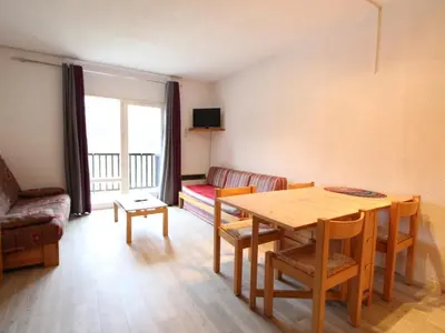 a living room with a table and a couch at Studio pour 4 personnes proche pistes et commerces à Flaine Forêt - FR-1-687-105 in Arâches-la-Frasse