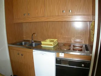 a small kitchen with a sink and a stove at Studio pour 4 personnes proche pistes et commerces à Flaine Forêt - FR-1-687-105 in Arâches-la-Frasse