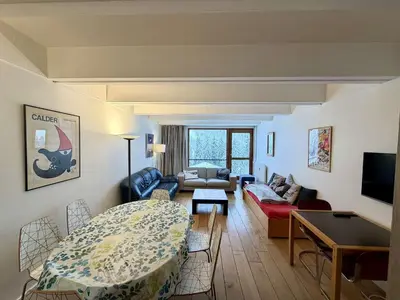 a living room with a bed and a couch at Appartement 3 pièces, 8 pers, Résidence Cassiopée, Flaine Forum, à 50m des pistes et commerces - FR-1-687-87 in Arâches-la-Frasse