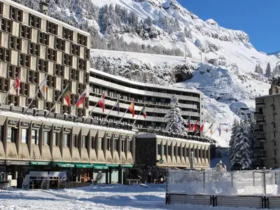 a hotel in the snow with a mountain in the background at Appartement 3 pièces, 8 pers, Résidence Cassiopée, Flaine Forum, à 50m des pistes et commerces - FR-1-687-87 in Arâches-la-Frasse