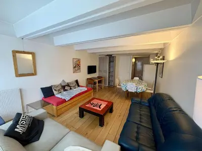 a living room with a couch and a table at Appartement 3 pièces, 8 pers, Résidence Cassiopée, Flaine Forum, à 50m des pistes et commerces - FR-1-687-87 in Arâches-la-Frasse