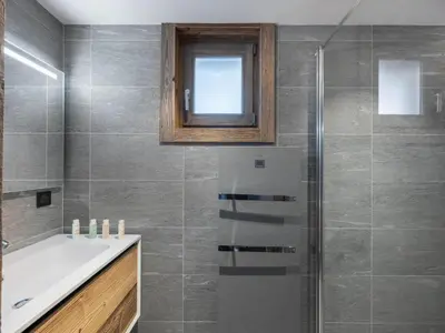 a bathroom with a tub and a sink and a shower at Chalet Familial Megève avec Espace Wellness - FR-1-569-56 in Megève