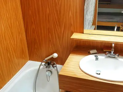 a bathroom with a sink and a bath tub at Studio 5 pers à Flaine, proche pistes et commerces, animaux admis - FR-1-687-91 in Arâches-la-Frasse