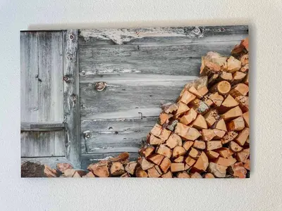 a pile of fire wood next to a wooden door at Studio confortable pour 4 personnes au pied des pistes - FR-1-642-75 in Morillon