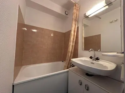 a bathroom with a sink and a tub and a mirror at Studio confortable pour 4 personnes au pied des pistes - FR-1-642-75 in Morillon