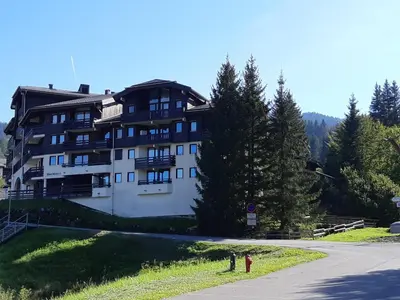 a large building on the side of a road at Studio confortable pour 4 personnes au pied des pistes - FR-1-642-75 in Morillon
