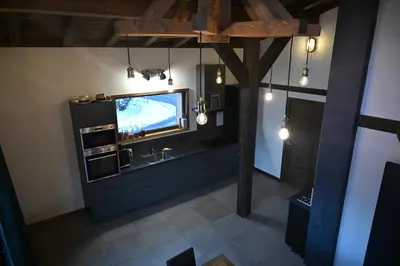 an overhead view of a bathroom with a sink and a tv at Chalet Montana in Combloux