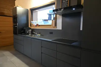 a kitchen with a sink and a window at Chalet Montana in Combloux