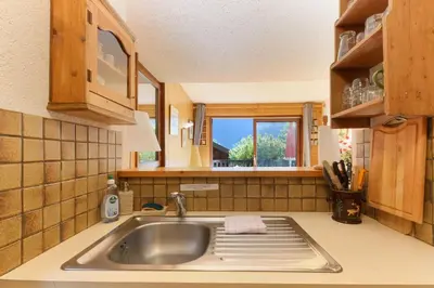 a kitchen with a sink and a window at Les Terrasses de Planpraz - 8min Walk to Center - Quiet - Perfect for Hiking in Chamonix-Mont-Blanc