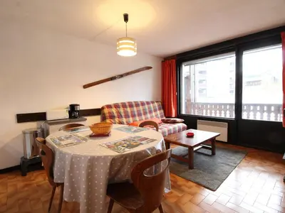 a living room with a table and a couch at 3P 6 Pers, Cuisine rénovée, Balcon Sud, Proche Pistes et Commerces, Parking, Casier à skis - FR-1-572-204 in Arâches-la-Frasse